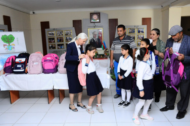 Children from low-income families were presented with school supplies and bags