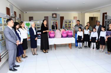 Children from low-income families were presented with school supplies and bags