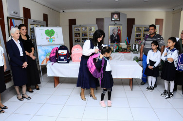 Children from low-income families were presented with school supplies and bags