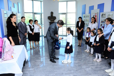 Children from low-income families were presented with school supplies and bags