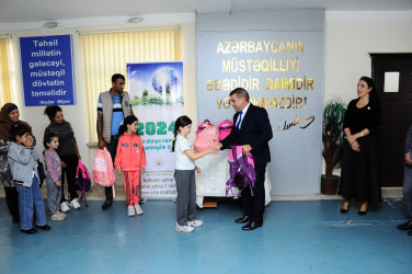 Children from low-income families were presented with school supplies and bags